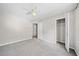 Spacious bedroom with neutral walls, ceiling fan, and carpeted floor at 5590 Princeton Oaks Dr, Sugar Hill, GA 30518