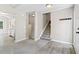 Inviting foyer that features a staircase and luxury vinyl plank flooring at 5590 Princeton Oaks Dr, Sugar Hill, GA 30518