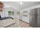 Bright kitchen features stainless steel appliances, granite countertops, and views of the backyard at 5590 Princeton Oaks Dr, Sugar Hill, GA 30518