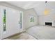 Inviting living room with vaulted ceiling, fireplace, and bright natural light at 5590 Princeton Oaks Dr, Sugar Hill, GA 30518