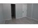Bright bedroom with clean, neutral paint and modern gray wood-look floors at 6460 Wellington Chase Ct, Lithonia, GA 30058