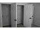 Gray bedroom featuring large closet with white sliding doors and shelves at 6460 Wellington Chase Ct, Lithonia, GA 30058