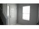 Inviting entryway featuring lots of light from the large window and clean, neutral walls at 6460 Wellington Chase Ct, Lithonia, GA 30058