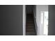 Carpeted stairway with gray walls and white trim, leading to the upper level at 6460 Wellington Chase Ct, Lithonia, GA 30058