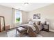 Bright bedroom featuring a window, and a cozy rug at 208 Starr Cir, Stockbridge, GA 30281