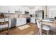Well-lit kitchen with stainless steel appliances, white cabinetry, and a dining area at 208 Starr Cir, Stockbridge, GA 30281