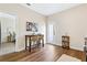 Charming kitchenette with bar seating, stylish decor, and hardwood floors at 208 Starr Cir, Stockbridge, GA 30281