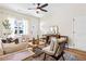 Bright living room with natural light, wood floors, and contemporary decor at 208 Starr Cir, Stockbridge, GA 30281