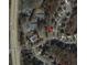 Aerial view showcasing the property's location within a neighborhood, including tennis courts and amenities at 3915 Northridge Dr, Cumming, GA 30040