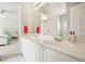 Bright bathroom featuring a double sink vanity, large mirror, and white cabinetry at 3915 Northridge Dr, Cumming, GA 30040