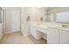 Bright bathroom with double vanity, neutral colors, tile flooring, and glass-enclosed shower at 3915 Northridge Dr, Cumming, GA 30040