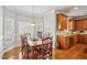 Bright dining area features a wooden table and lots of natural light from the large windows at 3915 Northridge Dr, Cumming, GA 30040