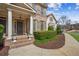Inviting front porch with white pillars and well-manicured landscaping at 3915 Northridge Dr, Cumming, GA 30040