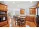 Spacious kitchen features stainless appliances, breakfast bar, hardwood floors and a view of the dining area at 3915 Northridge Dr, Cumming, GA 30040