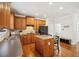 Well-lit kitchen featuring wooden cabinets, an island, and modern appliances at 3915 Northridge Dr, Cumming, GA 30040
