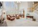 Open-concept living area with a staircase and views into the kitchen at 3915 Northridge Dr, Cumming, GA 30040