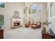 Spacious living room with high ceilings, a cozy fireplace, and lots of natural light at 3915 Northridge Dr, Cumming, GA 30040