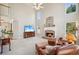 Cozy living room with a fireplace, comfortable seating, and large windows at 3915 Northridge Dr, Cumming, GA 30040