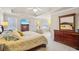 Large bedroom with tray ceiling, neutral colors, plenty of natural light and adjoining sitting room at 3915 Northridge Dr, Cumming, GA 30040