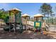 Well-maintained community playground with slide, climbing structures, and protective mulch ground cover at 3915 Northridge Dr, Cumming, GA 30040