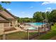Community pool area with ample seating, umbrellas, and a separate shallow pool for children at 3915 Northridge Dr, Cumming, GA 30040