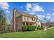 Brick home with manicured lawn and landscaping on a sunny day at 3915 Northridge Dr, Cumming, GA 30040