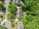Aerial view of the home showcasing its placement within a lush, green neighborhood at 420 Big Bend Trl, Sugar Hill, GA 30518