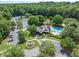 An aerial view of the community center with a fountain, parking area, and landscaping at 420 Big Bend Trl, Sugar Hill, GA 30518