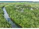 An aerial view showcasing the community's lush green surroundings and proximity to a river at 420 Big Bend Trl, Sugar Hill, GA 30518