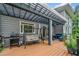 Spacious back deck with a grill, swing, and comfortable seating area perfect for outdoor relaxation at 420 Big Bend Trl, Sugar Hill, GA 30518