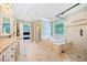 This is an en suite bathroom with a tub and walk-in shower at 420 Big Bend Trl, Sugar Hill, GA 30518