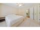 A well-lit bedroom featuring bright carpet, an open entryway, and natural sunlight at 420 Big Bend Trl, Sugar Hill, GA 30518