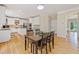 Eat-in kitchen dining area adjacent to bright white kitchen at 420 Big Bend Trl, Sugar Hill, GA 30518
