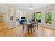 Eat-in kitchen dining area with backyard views leading into the living room at 420 Big Bend Trl, Sugar Hill, GA 30518