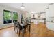 Eat-in kitchen dining area with backyard access next to gourmet kitchen at 420 Big Bend Trl, Sugar Hill, GA 30518