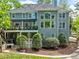 Back exterior of the home featuring a spacious deck and large windows offering ample natural light at 420 Big Bend Trl, Sugar Hill, GA 30518