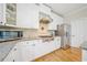 Charming kitchen includes granite counters, a stainless steel refrigerator, and ample storage at 420 Big Bend Trl, Sugar Hill, GA 30518