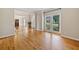 Open living space with hardwood floors, large window, and natural light at 420 Big Bend Trl, Sugar Hill, GA 30518