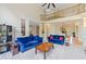 Bright living room boasts soaring ceilings, open layout, and elegant staircase with wrought iron railings at 420 Big Bend Trl, Sugar Hill, GA 30518