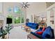 Sun-drenched living room with high ceilings, fireplace, and a seamless transition to the kitchen at 420 Big Bend Trl, Sugar Hill, GA 30518