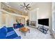Spacious living room showcasing a stone fireplace, large windows, and an open design at 420 Big Bend Trl, Sugar Hill, GA 30518