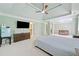 This is a spacious main bedroom featuring a television and en suite bath at 420 Big Bend Trl, Sugar Hill, GA 30518