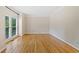 Office features hardwood floors, neutral walls, large windows, and crown molding at 420 Big Bend Trl, Sugar Hill, GA 30518