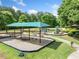 Community playground with swings, slides, and shaded areas for to enjoy outdoor activities at 420 Big Bend Trl, Sugar Hill, GA 30518
