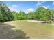 Expansive green space featuring a volleyball court and other community recreational facilities at 420 Big Bend Trl, Sugar Hill, GA 30518