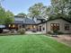 Serene backyard featuring a patio, outdoor seating, and a well-manicured lawn at 4531 Kings Lake Dr, Marietta, GA 30067