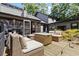 Backyard deck with cushioned patio seating, a wooden deck, and an outdoor grill for outdoor enjoyment at 4531 Kings Lake Dr, Marietta, GA 30067