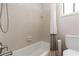Bathroom featuring a white tiled shower and bathtub at 4531 Kings Lake Dr, Marietta, GA 30067