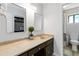 Bathroom with tan marble-look counters, dark wood cabinets, and a shower/tub combo at 4531 Kings Lake Dr, Marietta, GA 30067