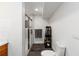 Clean, minimalist bathroom with glass shower, modern toilet and sleek tile flooring at 4531 Kings Lake Dr, Marietta, GA 30067